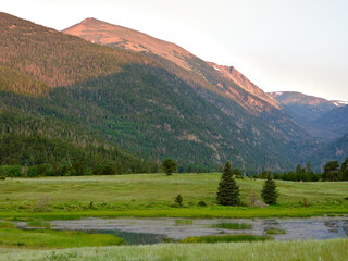 Sunset last light hits the mountain peaks in the Colorado Rocky Mountains