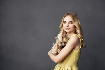 Fototapeta premium woman with small purebred dog and fun fashion friendship