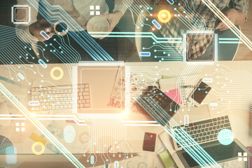 Double exposure of man and woman working together and data theme hologram drawing. Computer background. Top View.