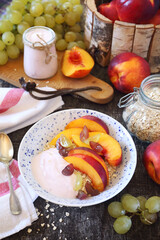 Healthy breakfast. Oatmeal, fruit yogurt, peaches and grapes