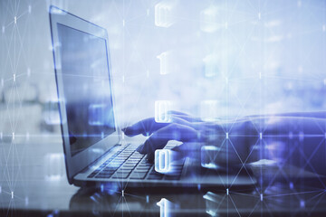 Double exposure of woman hands working on computer and data theme hologram drawing. Tech concept.