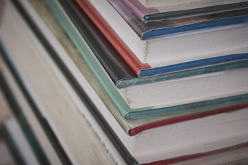 Old reading books stacked on a warehouse floor