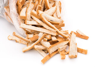 Bread crumbs or dried breadcrumbs on a white background