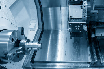 The  CNC lathe machine forming cutting at the metal  shape parts.