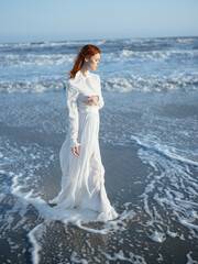Fototapeta na wymiar Woman in white dress beach travel vacation landscape