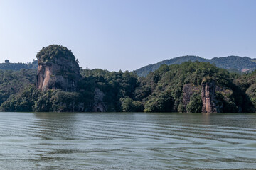The lake reflects the mountains of Danxia landform