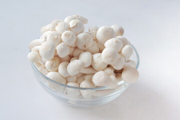Shimeji mushroom in bowl on white background.