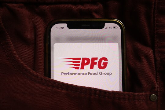 KONSKIE, POLAND - September 04, 2021: Performance Food Group Company PFG logo on mobile phone hidden in jeans pocket