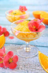 Orange granita, frozen summer dessert in two glasses