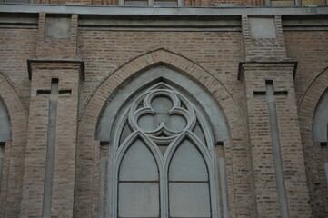 Neogothic window gracing the basilica's wall