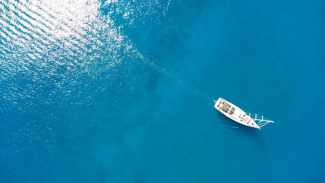 amazing view to yacht, swimming woman and clear water.