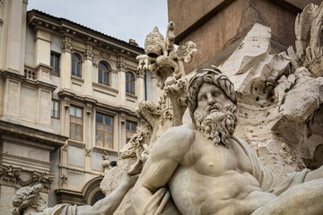 A statue of the the Ganges river god,  part of the Fontana dei Quattro Fiumi (Fountain of the Four Rivers),  in the Piazza Navona, Rome, Italy 