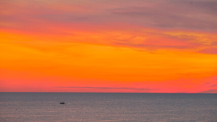 The natural background of the morning light rising in the middle of the sea and surrounded by mountains, cool breezes, the beauty of the ecology of the tourist attractions.