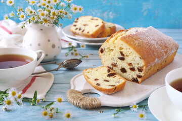 Summer dessert. Raisin cake and two cups of tea