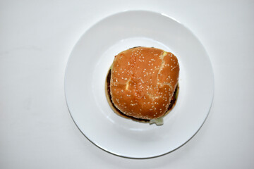 Double juicy meat burger on a white plate