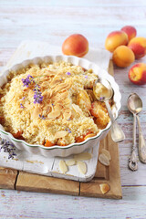 Summer dessert. Fresh apricot crumble, almonds petal and dry lavender dressing