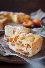 Apricot spong cake, icing sugar dressing