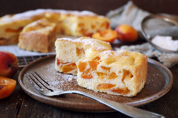 Apricot spong cake, icing sugar dressing