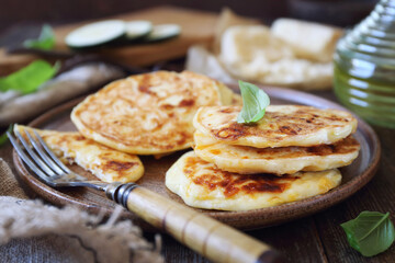 Zucchini fritters. Vegetable squash pancakes with cheese