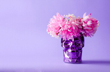 Decorative background for the holiday Dia de Muertos. Decorative colored skull with a wreath on a...