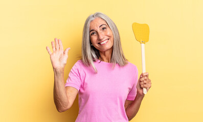 smiling happily and cheerfully, waving hand, welcoming and greeting you, or saying goodbye and...