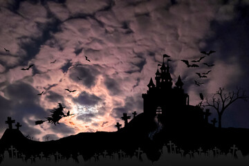 Halloween - nawiedzony dom na tle dramatycznego nieba, wiedźma i nietoperze.