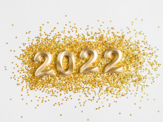 Greeting card with - happy new year with numbers 2022 in gold glitter