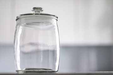 Empty glass jar for food pantry storage.