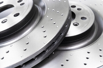Two car brake disc background texture. Auto spare parts. Perforated brake disc rotor. Braking...