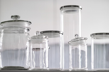 Empty glass jars for food pantry storage. - obrazy, fototapety, plakaty