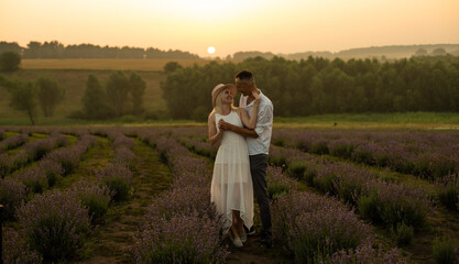 Couple in lavender field. Couple in hug.