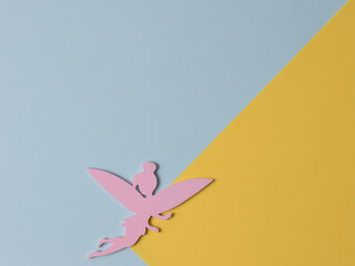 Top view flatlay lie concept view of little small Fairy, color background angel, background for children's party, fairy tale