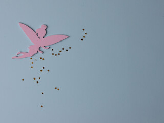 Top view flatlay lie concept view of little small Fairy, color background angel, background for children's party, fairy tale