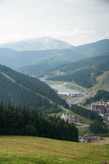 Fototapeta na wymiar Polyanytsya, Ukraine - August 17th, 2021: View from the panoramic lifts of ski resort Bukovel at summer.