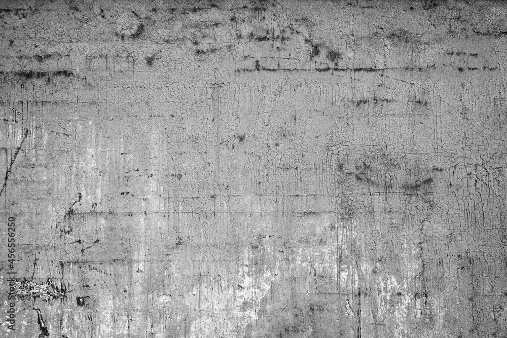 Poster front view of dirty and weathered wall with cracked plastering and paint. high resolution full frame