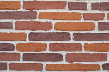 Rough old porous bricks with white grout. Texture surface background