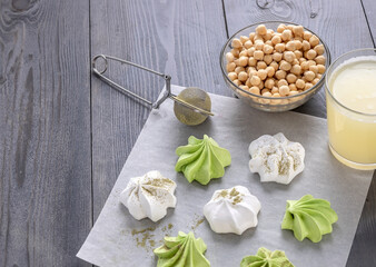 vegan meringue from aquafaba with matcha tea powder. healthy food