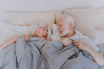 Elderly couple at home - Powered by Adobe
