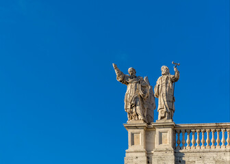 Fototapeta na wymiar Statues on the roof of the Papal Archbasilica of St. John in Lateran (Basilica di San Giovanni in Laterano), Italy, Rome
