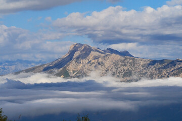 Caucasus, Ossetia. Peaks of Mount Qionhoh above the clouds.