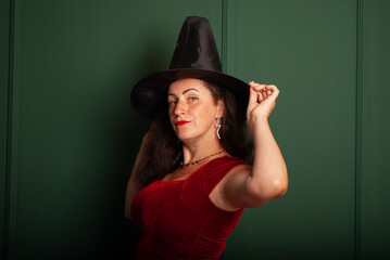 a vampire woman on a green background for Halloween in isolation