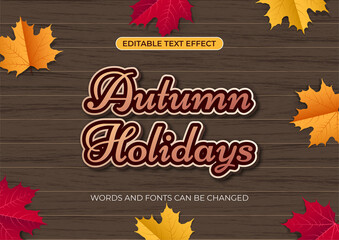 Editable Autumn Holidays text effect on wood table background with maple leaves