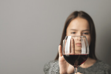 abstinence alcohol, stop liquor, teenager shows a sign of rejection of wine with her hand, refusal...