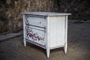 Chest of drawers made of solid natural wood with artistic painting