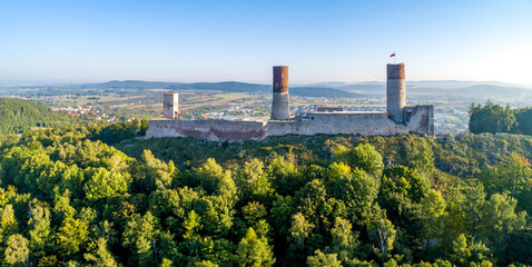 Medieval royal castle in Checiny near Kielce in Poland. Built in late 13th century. Ruin partly renovated. Aerial panorama in sunrise light.