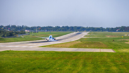 Airplane landing on the airport. Perfect view on the airplane with different high.