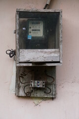 Fototapeta na wymiar old electricity meter on the wall