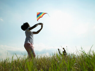 Children playing with kite in field