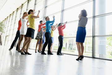 Business people dancing in office