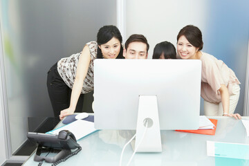 Fototapeta premium Colleagues looking at computer monitor